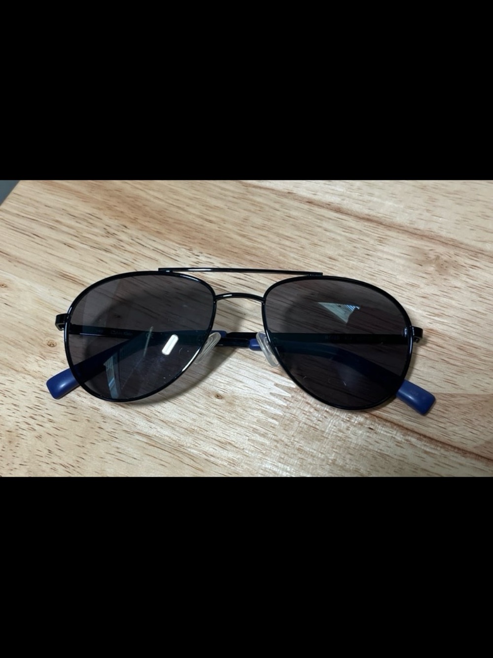 Calvin Klein Aviator Sunglasses with Blue End Accent